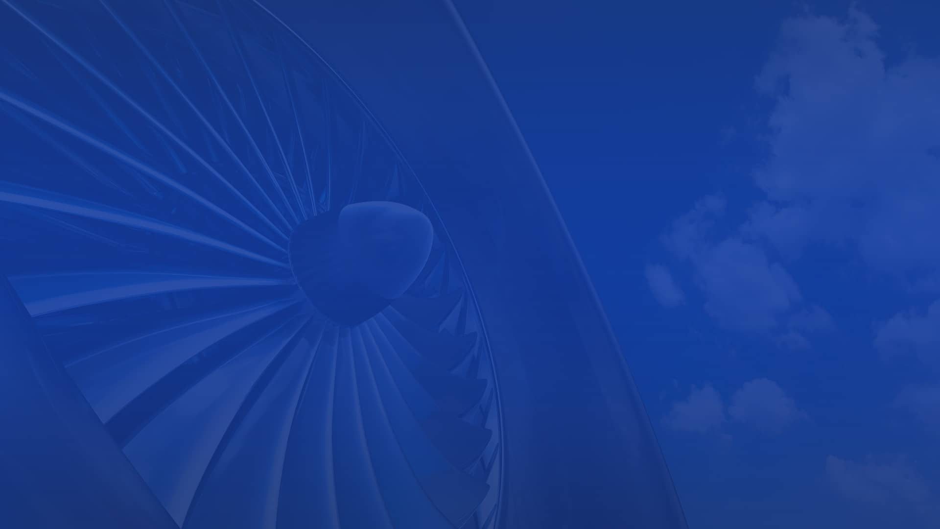 Close up aircraft turbine on blue sky with white clouds symbolizes aerospace industries