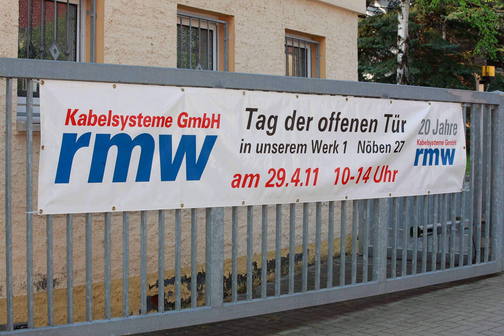 View of banner on fence: rmw invites to open day